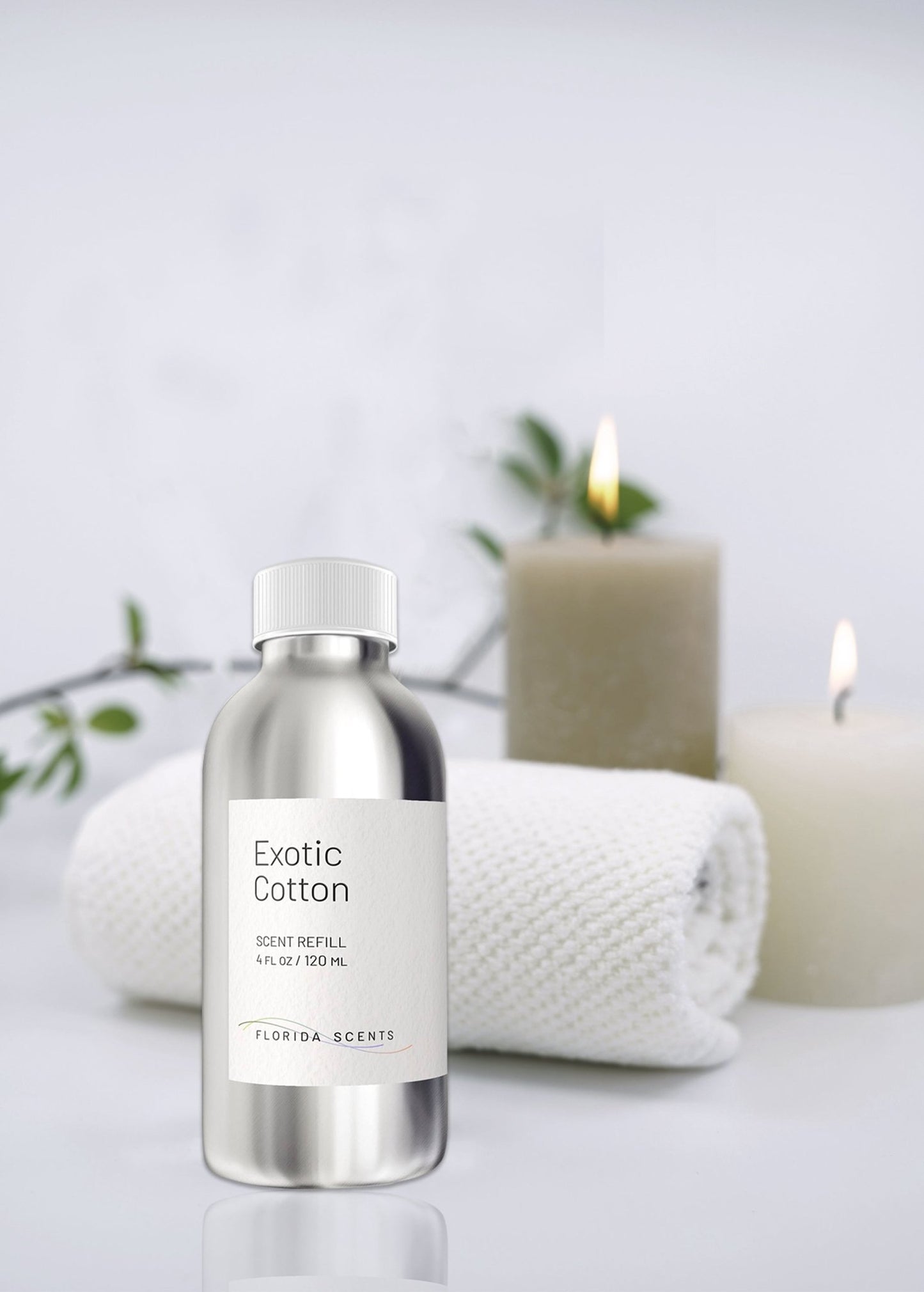 Florida Scents Essentials Exotic Cotton Scent Refill with candles and towel, perfect for creating a cozy and fresh home atmosphere.