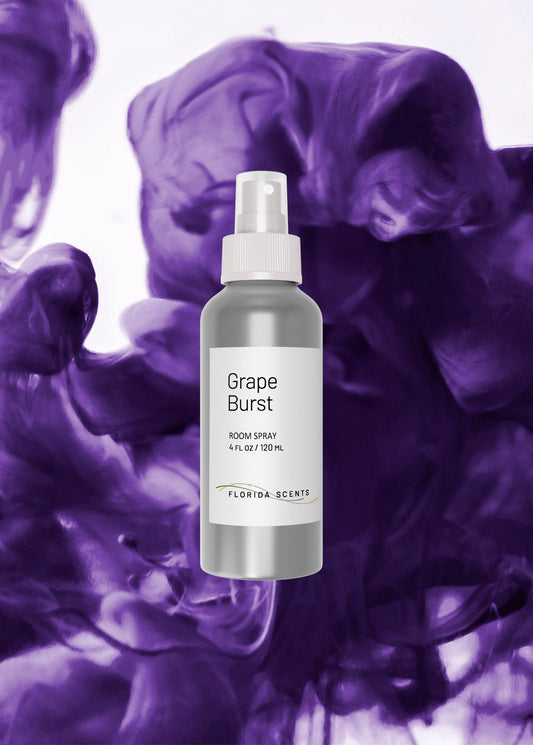 Grape Burst Room Spray by Florida Scents Essentials with a bold purple smoke background, ideal for energizing home spaces with a sweet, tarty aroma.