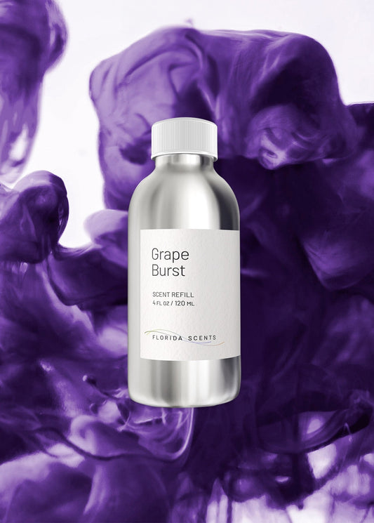 Grape Burst Scent Refill - Florida Scents Essentials in a sleek silver bottle with purple vapor background, ideal for energizing home spaces.