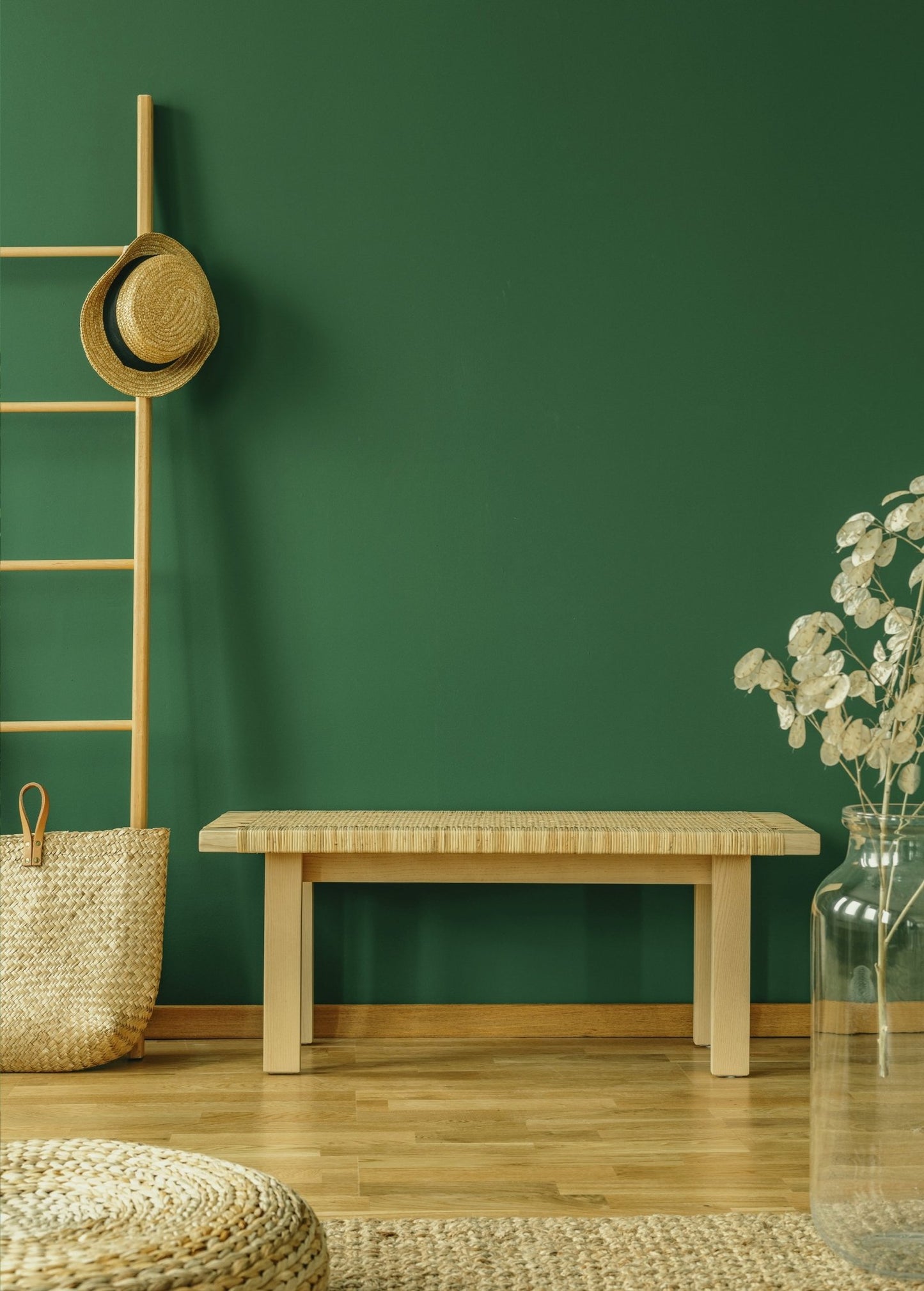 Minimalist home interior with green wall and natural decor, perfect setting for Green Clover Room Spray from Florida Scents Essentials.