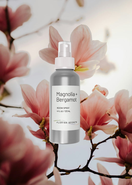 Magnolia + Bergamot Room Spray by Florida Scents Essentials with floral background. Ideal home fragrance for quiet mornings and calming spaces.