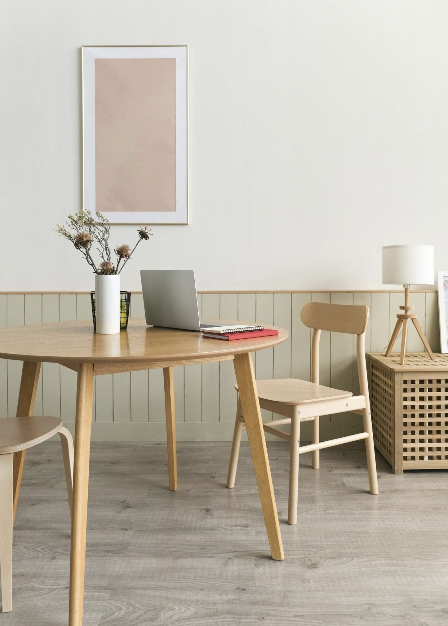 Minimalist home office with natural wood furniture, styled for a serene atmosphere ideal for using Magnolia + Bergamot Room Spray from Florida Scents Essentials.