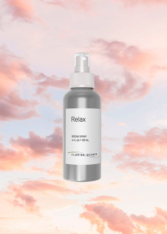 Relax Room Spray - Florida Scents Essentials bottle with minimalist label, set against a serene pink sky, ideal for home fragrance tranquility.
