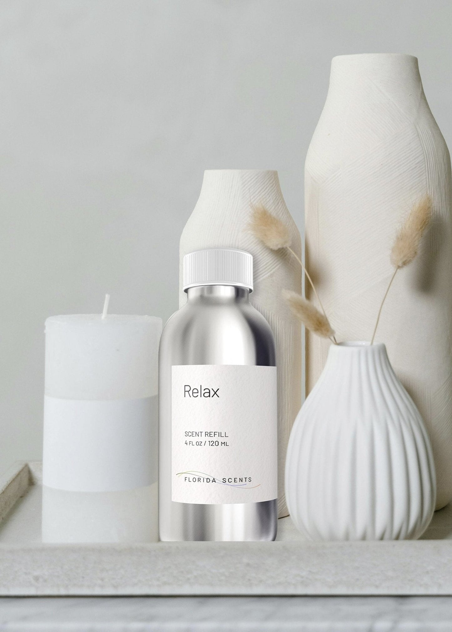 Relax Scent Refill - Florida Scents Essentials placed beside minimalist white decor, perfect for enhancing calm and reinvigorating home ambiance.