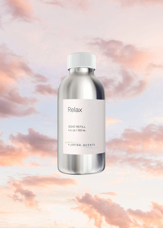 Relax Scent Refill - Florida Scents Essentials bottle floating against a serene pastel sky, ideal for promoting tranquility and relaxation.
