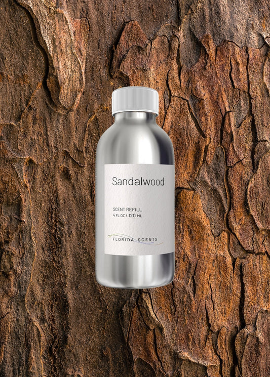 Sandalwood Scent Refill by Florida Scents Essentials placed against textured bark, ideal for home fragrance with warm, woody, and earthy notes.