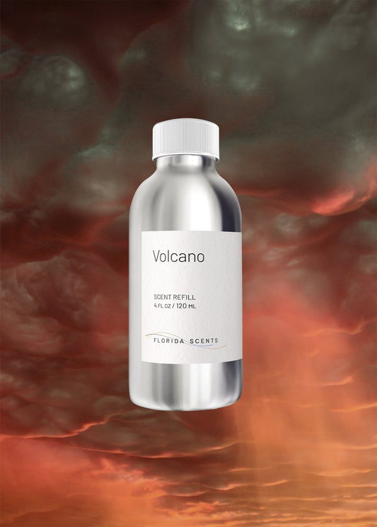 Volcano Scent Refill - Florida Scents Essentials bottle with metallic finish, set against a dramatic volcanic sky background. Ideal for tropical home ambiance.